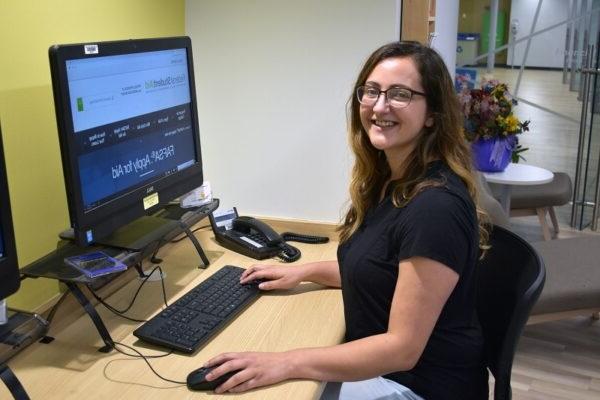 student at a computer with FAFSA website pulled up